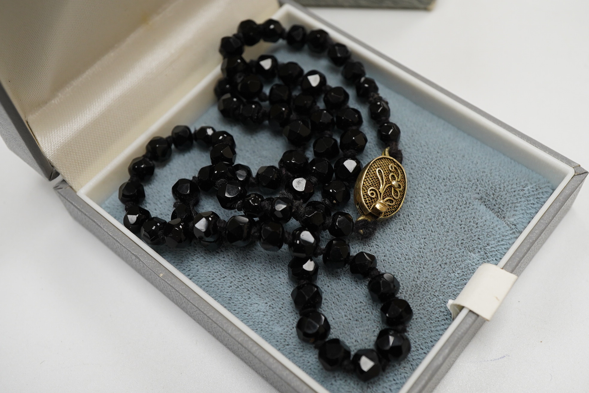 A quantity of assorted mainly costume jewellery, including paste brooch, facetted jet bead necklace, enamelled earrings, wrist watches, compact, lighters, etc.